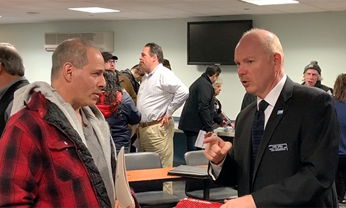 Union Representative Fred Wren talking to a member